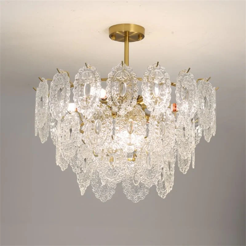 Rund lysekrone i krystal og forgyldt metal med LED i moderne design